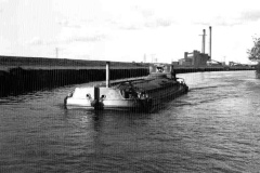A laden barge under way.
