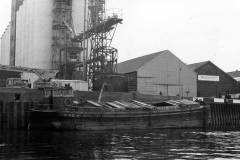 An unladen motor barge.