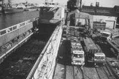 Timber being transferred to road-going vehicles.