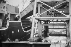 A collier loading coal at a compartment boat hoist.