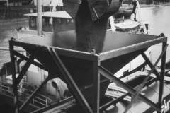Transferring coal to specially built railway wagons.