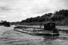 Three dumb barges under tow.