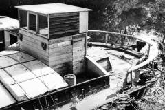 The wheelhouse of a berthed dumb barge.