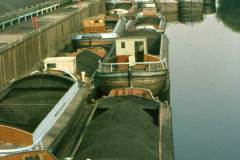 A mixture of barges at a coal staithe.