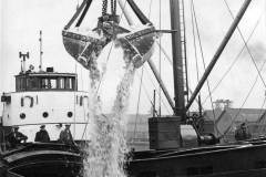 Discharging silver sand.