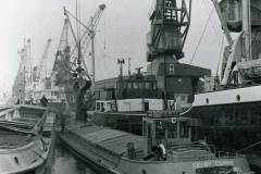 Discharging copra into SELBY CORRIE.
