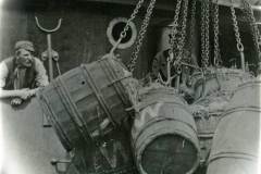 Unloading barrels in Goole Docks.