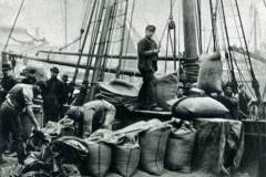 Discharging bagging wheat.