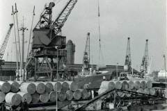 Discharging reels of paper.