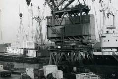 MV Pulp Trader loading cased heavy machinery in Goole Docks.