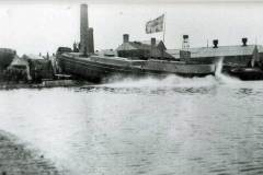 The stern first launch of a barge.