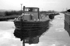 A train of laden compartment boats.