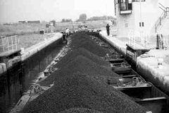 A train of laden compartment boats.