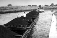 A train of laden compartment boats.