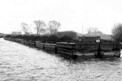 A train of laden compartment boats.
