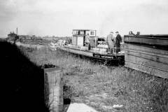British Waterways tug No 6 with a jebus and empty compartment boats.