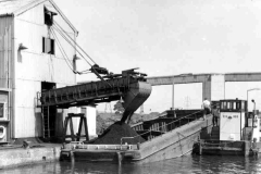 Loading coal into compartment boats.