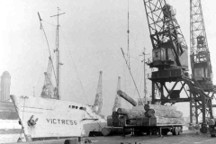 Victress discharging hardwood logs.