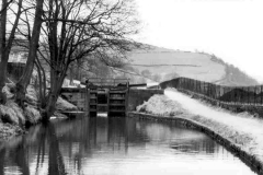 Approaching a canal lock gates.