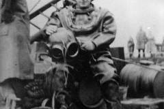 A diver preparing for work.