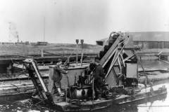 Two crew aboard a dredger.