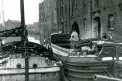Transhipping sacks of flour.