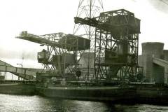 A barge at a coal staithe.