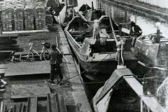 Transferring cargo to/from pairs of British Waterways narrowboats.