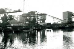 Barges at a coal loading wharf.