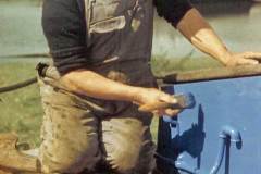 Painting the hold coaming.