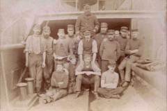 A ship's crew pose for a photo.