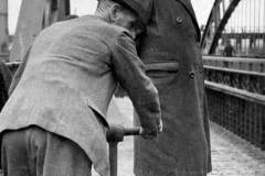 Two officials on a bridge