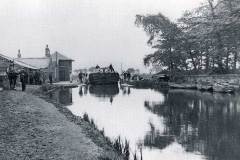 A draft horse drawn barge negotiating Heath Lock.