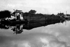 Tug CH102 and three compartment boats.