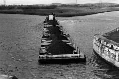 Tug CH 103 pushing compartment boats.