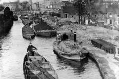 PHYLLIS surrounded by coal barges.