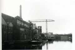 Barges Mossdale and Cordale H moored alongside a very large industrial unit.