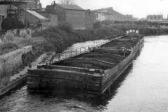A train of laden compartment boats.
