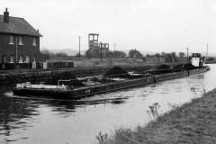 A compartment boat train passing Stanley Ferry.