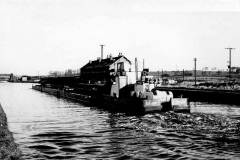 A compartment boat train approaching Stanley Ferry.
