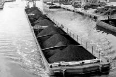 Compartment boats loaded with coal