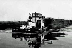 A tug and compartment boats.