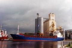 Anna moored alongside grain silos.