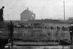 Workers repairing a dock wall in Goole.