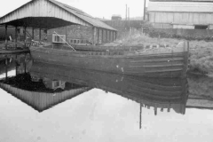 Angela Jane in front of a covered canal basin.