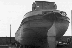 The motor barge Thoresby chocked up on a quayside.