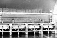 A compartment boat being unloaded.