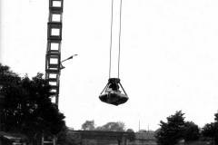 Unloading a dumb barge by overhead crane.