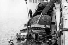 The motor barge Eskdale H being loaded with sand via a shute on the River Trent.