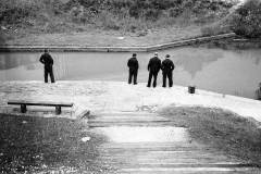 Men inspecting a canal section.